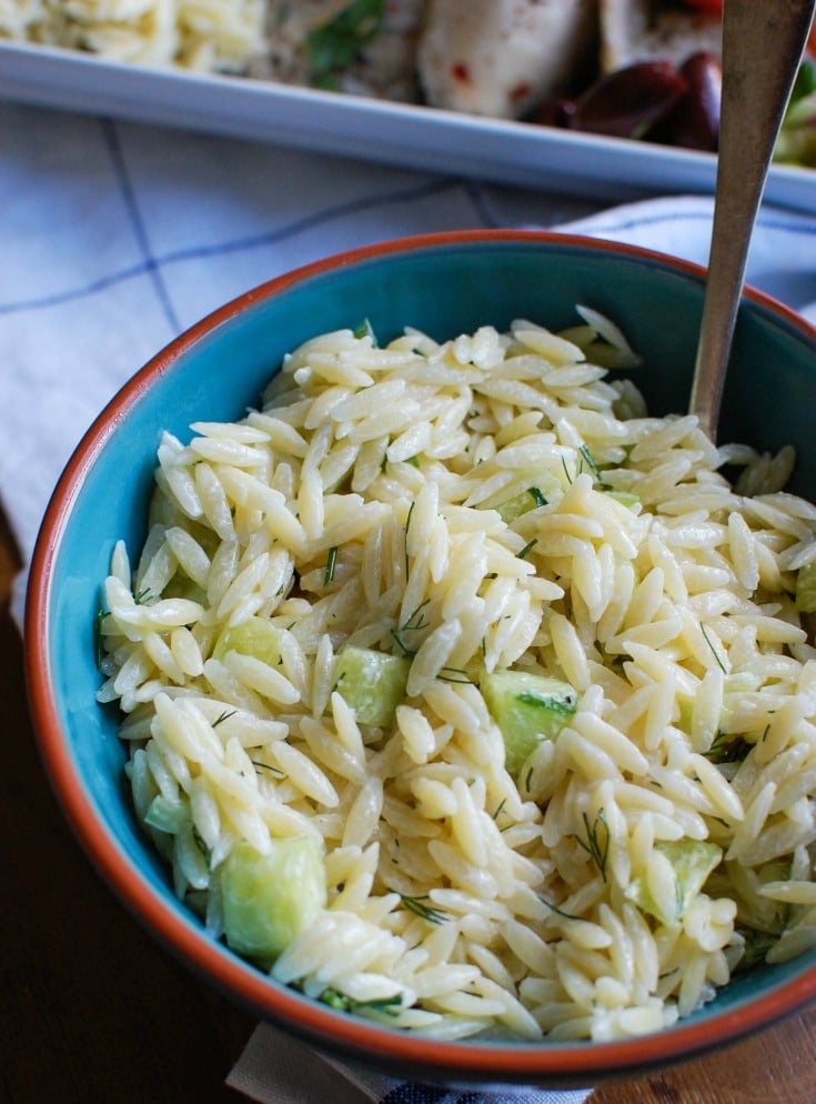 Greek Chicken with Tzatziki Orzo Salad orzo salad in blue bowl.