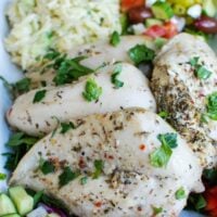 Greek Chicken with Tzatziki Orzo Salad in a big white dish.