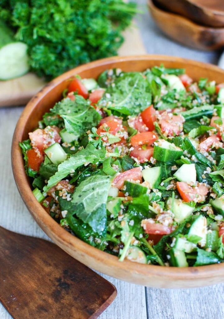 Kale Cucumber Tabbouleh with wooden spoon 
