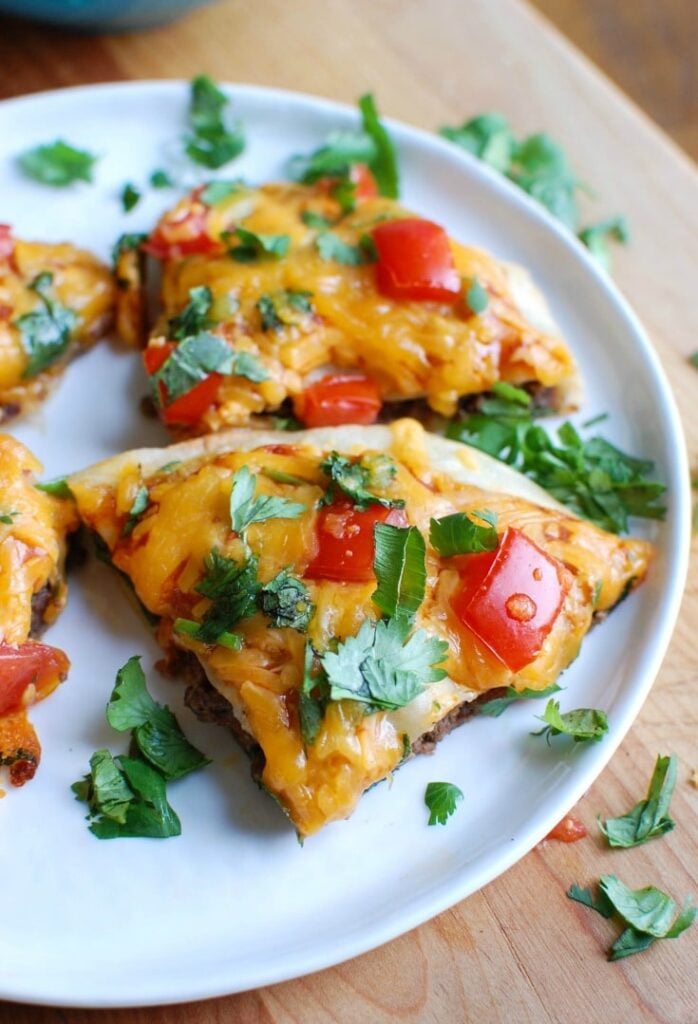 Mexican Pizzas are the perfect back-to-school dinner for your family that is easy to make, packed with flavor and a kid and adult favorite. Packed with protein and calcium, you can feel good putting this meal on your table! 