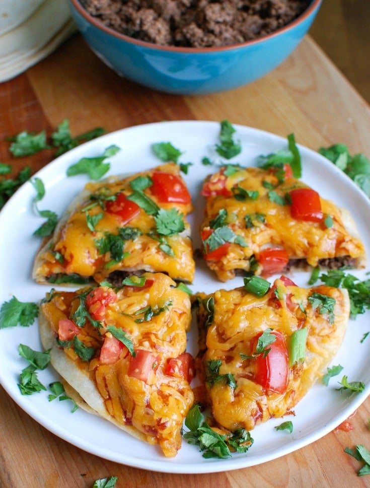 A Mexican Pizza is the perfect back-to-school dinner for your family that is easy to make, packed with flavor and a kid and adult favorite. Packed with protein and calcium, you can feel good putting this meal on your table!