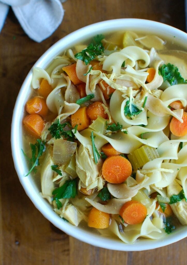 Slow Cooker Chicken Noodle Soup is the perfect fall comfort food that is easily made in the slow cooker. This is also a great immunity boosting soup for cold & flu season! 