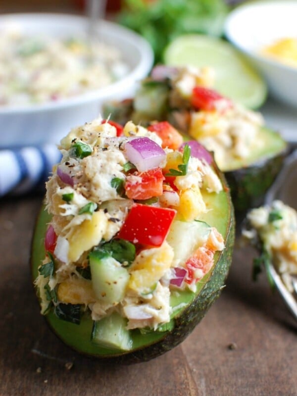 Tropical Tuna Stuffed Avocado is the perfect, quick and healthy lunch at your desk or on-the-go. Fresh mango, cilantro, fresh vegetables and lime juice is mixed with Sold White Albacore Tuna and Greek Yogurt and then stuffed in a delicious avocado.