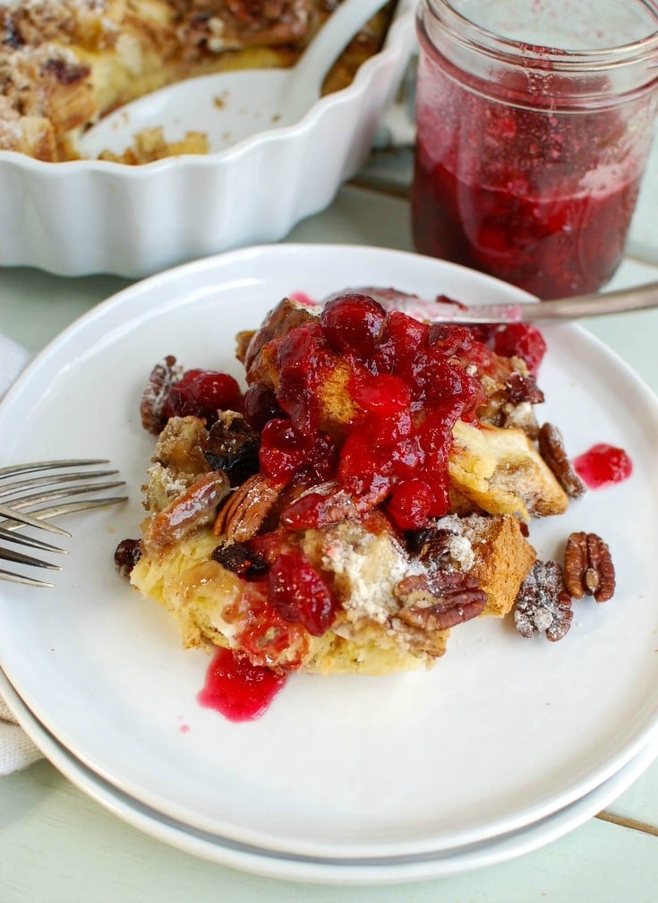 Wake up on Christmas morning to the sweet smell of Overnight Eggnog French Toast Bake with Cranberry Maple Syrup. This is a family favorite during the holidays!