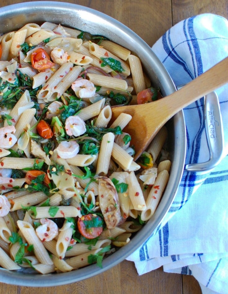Shrimp Kale Artichoke Pasta is light, healthy and an easy meal idea. Shrimp, kale, artichokes, tomatoes and pasta and tossed in a light lemon sauce that will leave your family asking for seconds! 