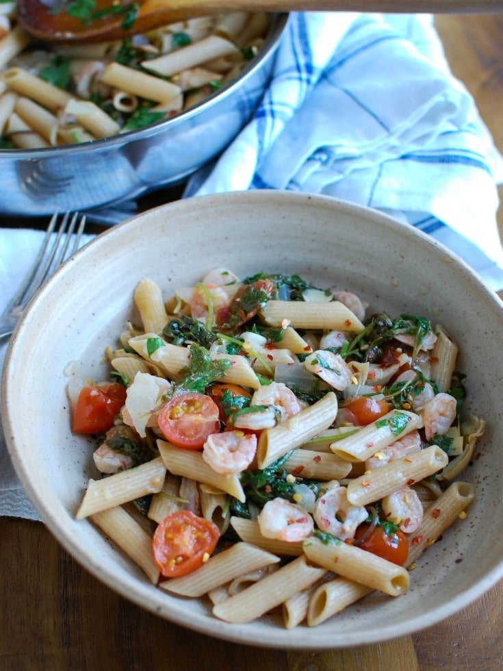 Shrimp Kale Artichoke Pasta is light, healthy and an easy meal idea. Shrimp, kale, artichokes, tomatoes and pasta and tossed in a light lemon sauce that will leave your family asking for seconds! 
