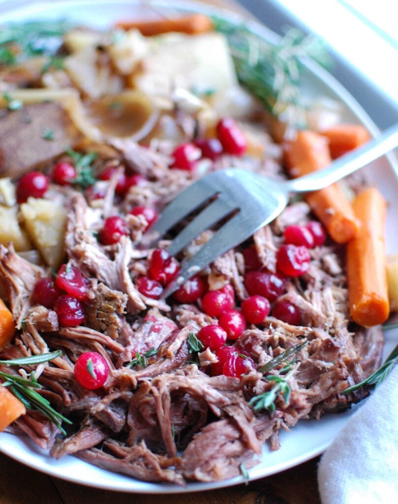 Slow Cooker Red Wine Pot Roast With Orange Cranberry Sauce is the perfect winter comfort food. This pot roast is flavorful and would make a nice holiday meal. The orange cranberry sauce adds a nice touch of sweetness to the roast and a pop of color to your table.