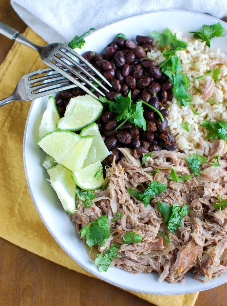 Slow Cooker Cuban Pork Rice Bowls with limes.