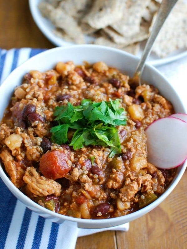 Slow Cooker Turkey Quinoa Chili is hearty, healthy and cooks all day in your crockpot! You can come home to a warm, comforting bowl of chili without spending time in the kitchen. This is perfect for dinner or watching football