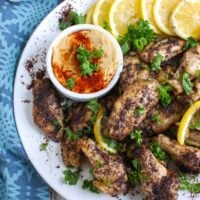 Sumac Lemon Baked Chicken Wings are baked to perfection- creating crispy, juicy chicken wings. These wings are tart, sweet and lemony, the perfect mix of flavors to pair with creamy hummus or a yogurt dipping sauce and a fresh salad.
