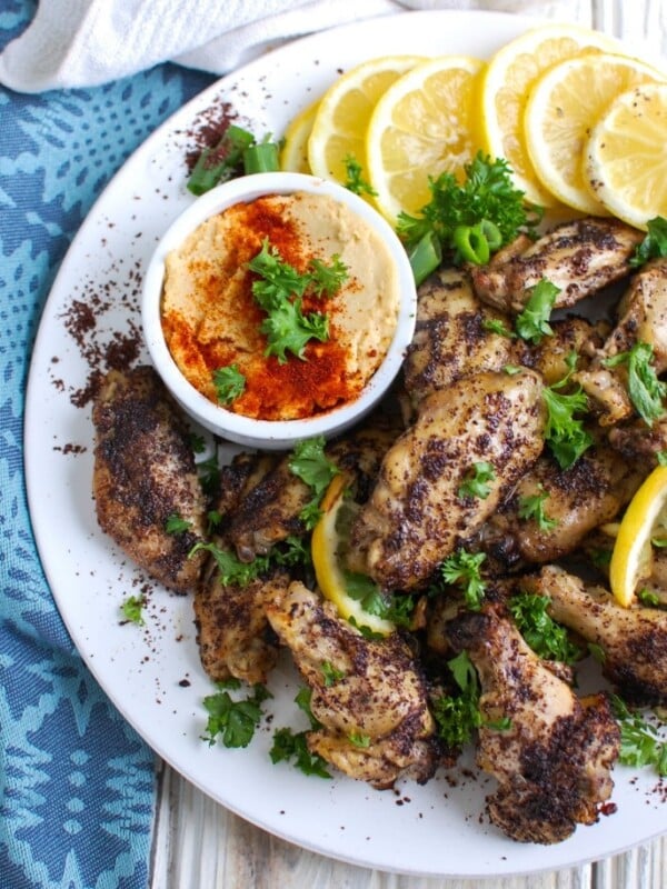 Sumac Lemon Baked Chicken Wings are baked to perfection- creating crispy, juicy chicken wings. These wings are tart, sweet and lemony, the perfect mix of flavors to pair with creamy hummus or a yogurt dipping sauce and a fresh salad.
