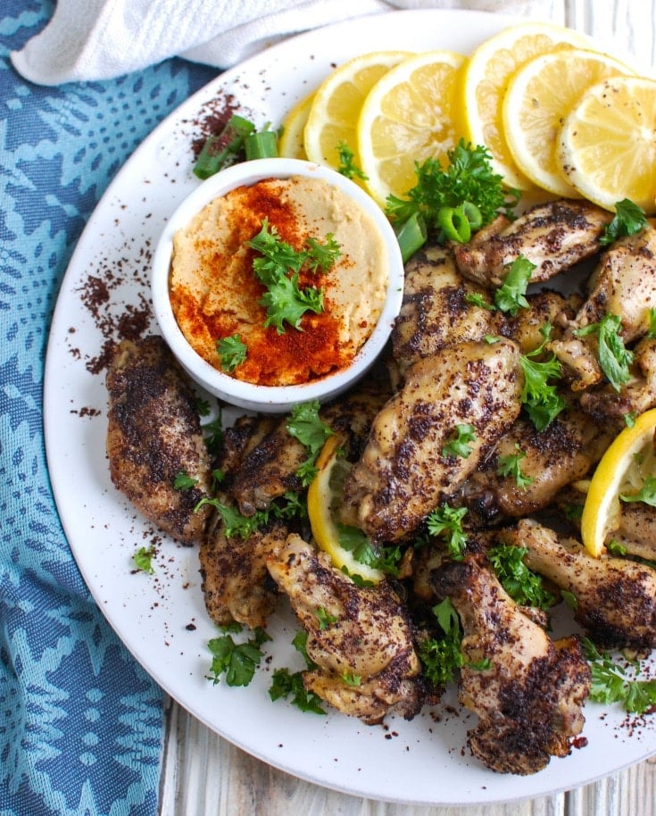 Sumac Lemon Baked Chicken Wings are baked to perfection- creating crispy, juicy chicken wings. These wings are tart, sweet and lemony, the perfect mix of flavors to pair with creamy hummus or a yogurt dipping sauce and a fresh salad.
