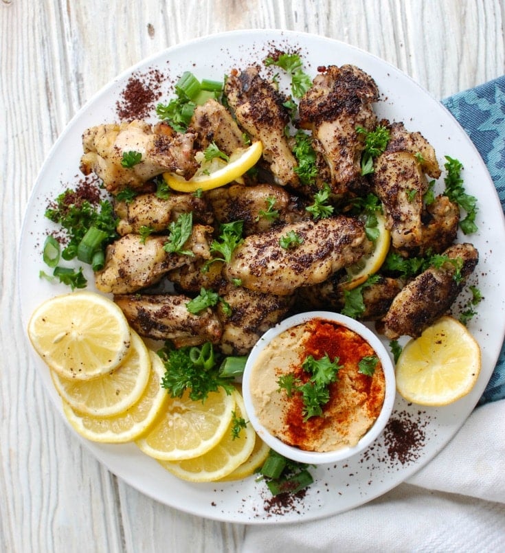 Sumac Lemon Baked Chicken Wings are baked to perfection- creating crispy, juicy chicken wings. These wings are tart, sweet and lemony, the perfect mix of flavors to pair with creamy hummus or a yogurt dipping sauce and a fresh salad.