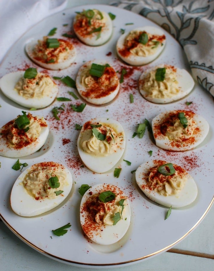 Southwestern Greek Yogurt Deviled Eggs are a healthy take on classic deviled eggs with a Southwestern twist. These deviled eggs use plain whole milk Greek yogurt in place of traditional mayonnaise for a healthy swap. Deviled eggs make a nice appetizer or finger food at a party, but also a great dish to bring to a summer pot-luck.