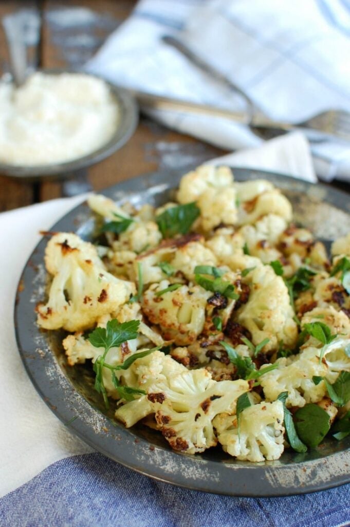 Roasted Parmesan Garlic Cauliflower makes a nice side dish to your dinner. Roasted cauliflower is sweet and pairs perfectly with garlic and cheese. 