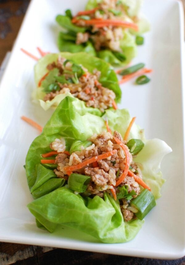 Asian Pork Lettuce Wraps are packed with your favorite Asian flavors and paired with ground pork, topped with cilantro and matchstick carrots and served in soft bibb lettuce wraps. These are light and the perfect easy meal! 
