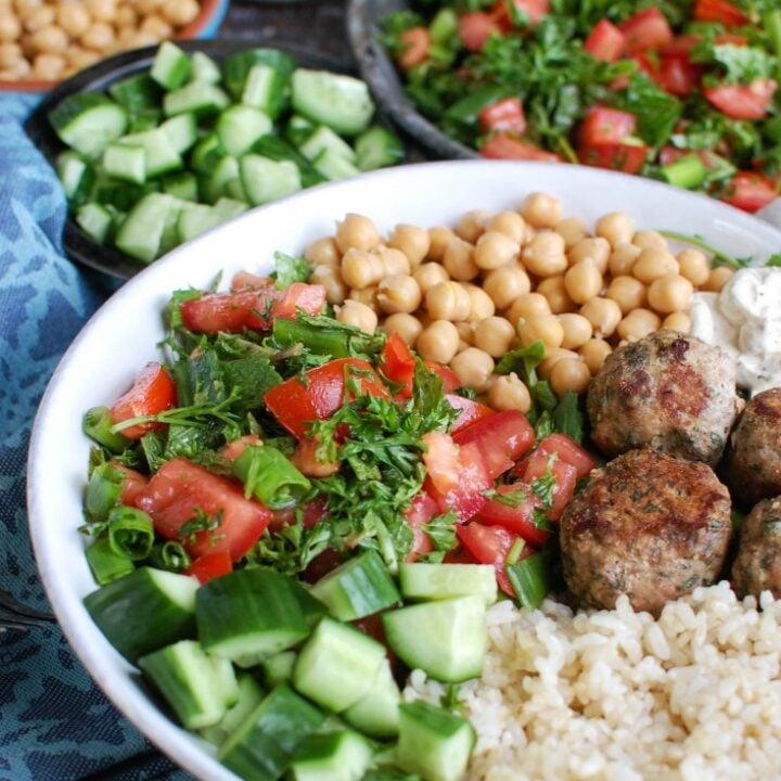 Mediterranean Baked Turkey Meatballs with a spoon.