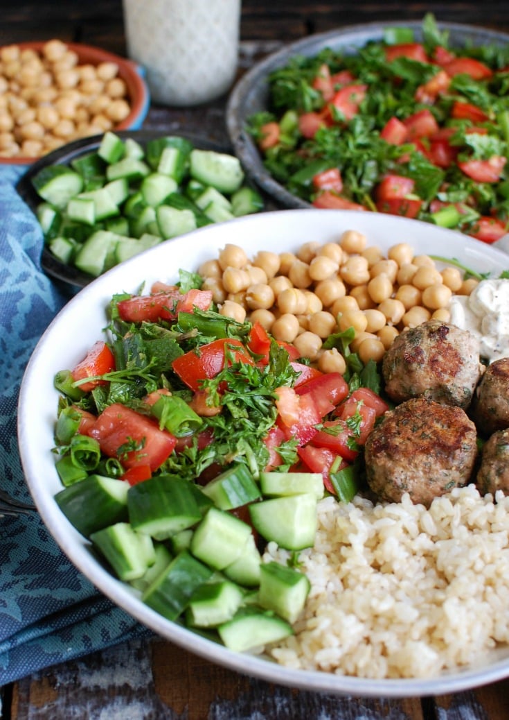 Mediterranean Baked Turkey Meatballs with a spoon.