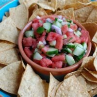 5 Ingredient Watermelon Salsa is a simple summer salsa using fresh watermelon, cucumber, red onion, cilantro and lime juice to create the perfect snack with chips or addition to grilled chicken or fish. Your guests will love this one!