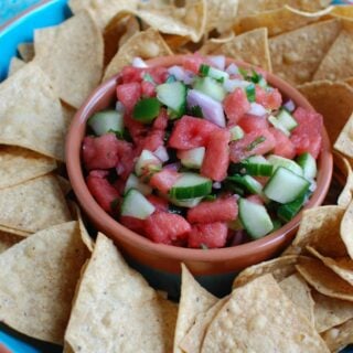 5 Ingredient Watermelon Salsa is a simple summer salsa using fresh watermelon, cucumber, red onion, cilantro and lime juice to create the perfect snack with chips or addition to grilled chicken or fish. Your guests will love this one!