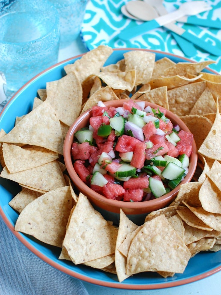 5 Ingredient Watermelon Salsa is a simple summer salsa using fresh watermelon, cucumber, red onion, cilantro and lime juice to create the perfect snack with chips or addition to grilled chicken or fish. Your guests will love this one!