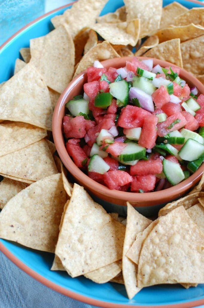 5 Ingredient Watermelon Salsa is a simple summer salsa using fresh watermelon, cucumber, red onion, cilantro and lime juice to create the perfect snack with chips or addition to grilled chicken or fish. Your guests will love this one!