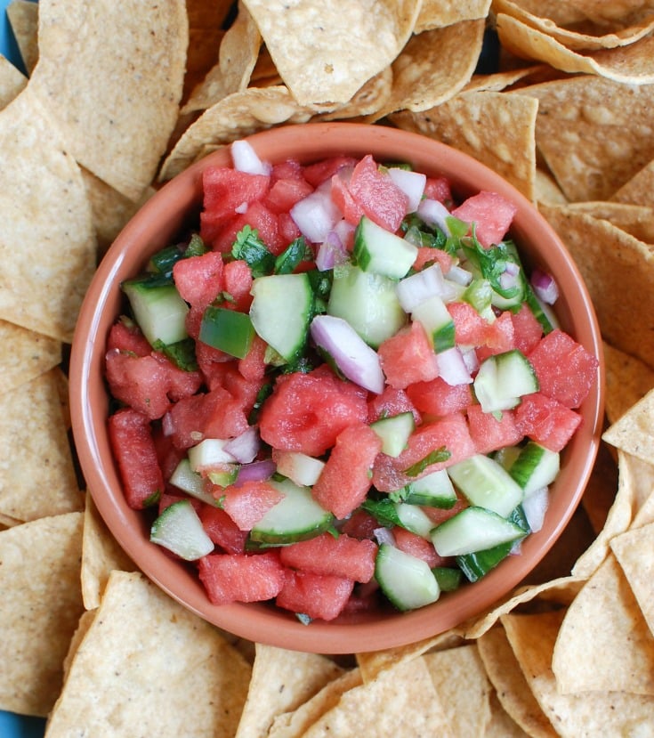 5 Ingredient Watermelon Salsa is a simple summer salsa using fresh watermelon, cucumber, red onion, cilantro and lime juice to create the perfect snack with chips or addition to grilled chicken or fish. Your guests will love this one!