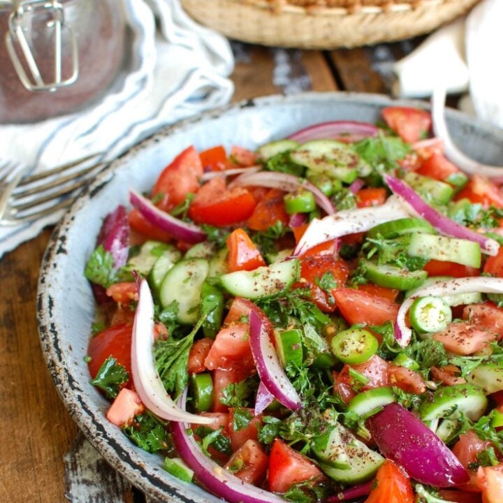 Persian Tomato Cucumber Salad is a fresh, light salad mixing tomatoes, cucumber, red onion, jalapeño, fresh mint and parsley and topped with an olive oil lemon dressing. This is the perfect side dish to any dinner or a nice lunch with some added chickpeas or grilled chicken. 