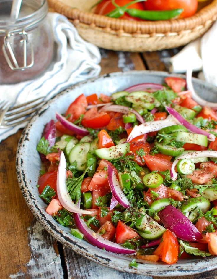 Persian Tomato Cucumber Salad is a fresh, light salad mixing tomatoes, cucumber, red onion, jalapeño, fresh mint and parsley and topped with an olive oil lemon dressing. This is the perfect side dish to any dinner or a nice lunch with some added chickpeas or grilled chicken.