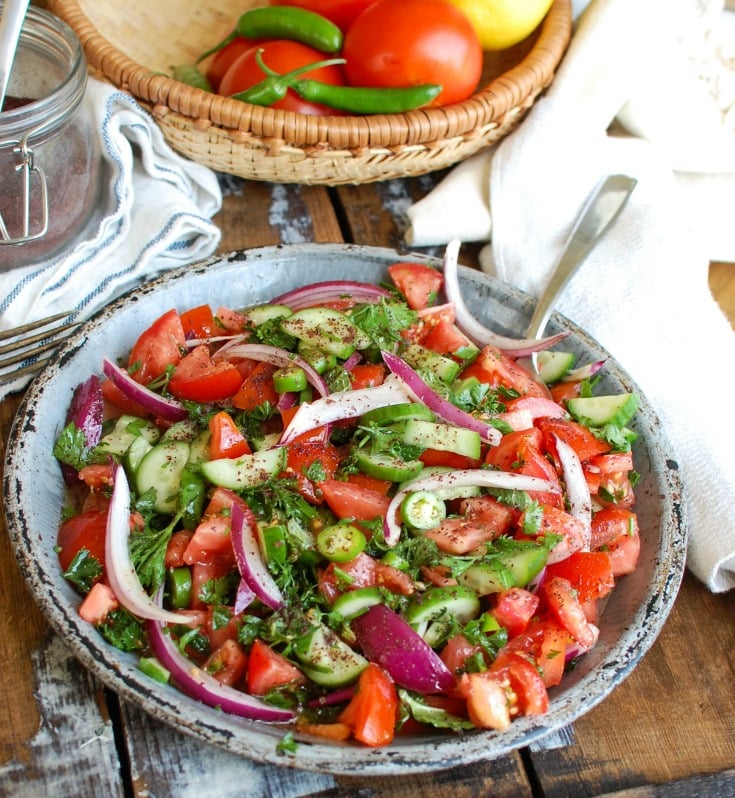 Persian Tomato Cucumber Salad is a fresh, light salad mixing tomatoes, cucumber, red onion, jalapeño, fresh mint and parsley and topped with an olive oil lemon dressing. This is the perfect side dish to any dinner or a nice lunch with some added chickpeas or grilled chicken. 