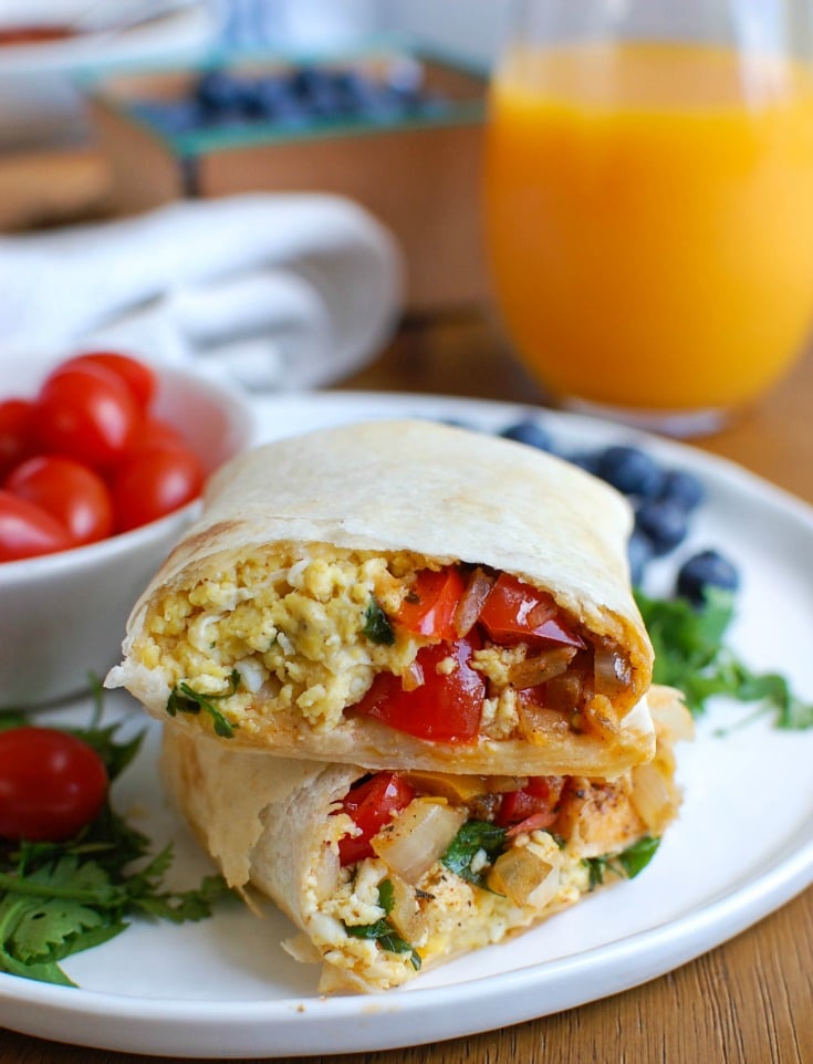 Vegetarian Breakfast Egg Burritos are a nice make-ahead breakfast for those busy days, especially during the school year. These breakfast burritos are loaded with veggies, eggs and cheese along with warm Southwestern spices. Make a big batch of these burritos and freeze them for later! 