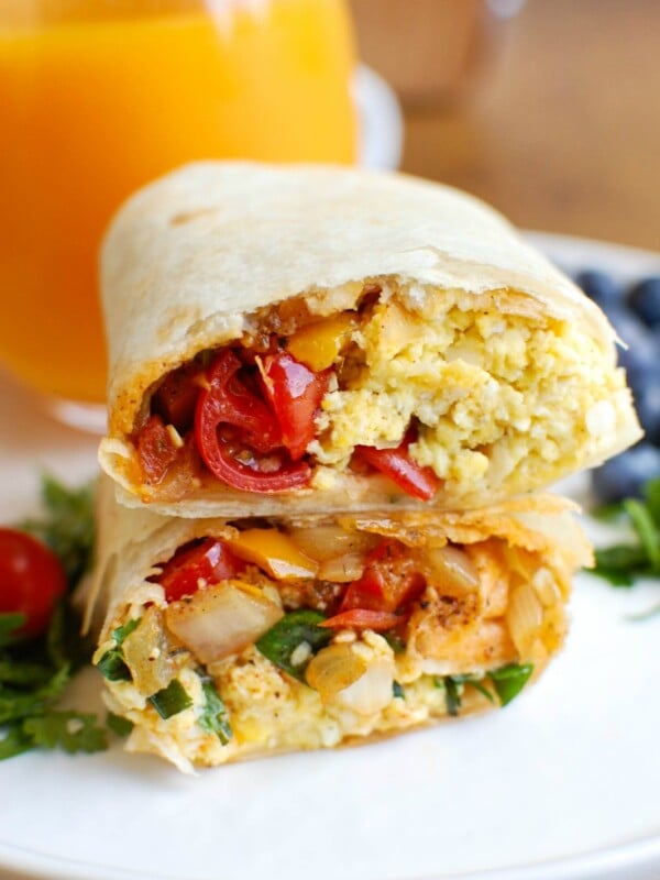Vegetarian Breakfast Egg Burritos are a nice make-ahead breakfast for those busy days, especially during the school year. These breakfast burritos are loaded with veggies, eggs and cheese along with warm Southwestern spices. Make a big batch of these burritos and freeze them for later! 