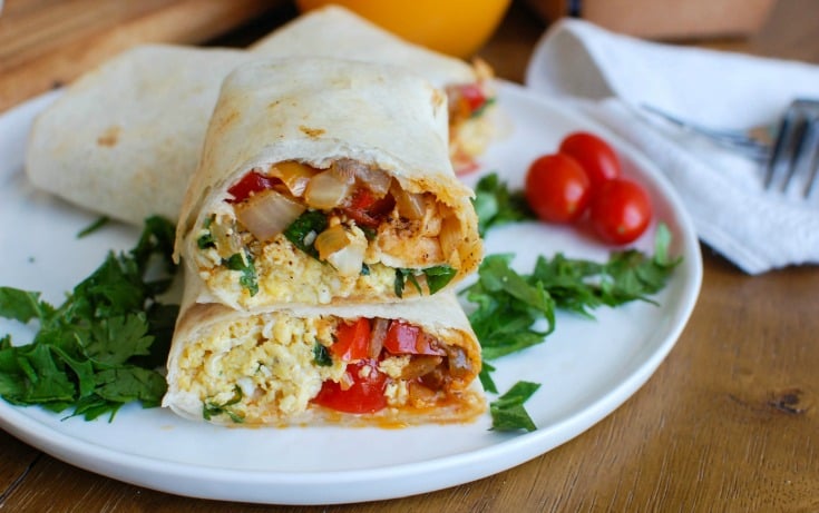 Vegetarian Breakfast Egg Burritos are a nice make-ahead breakfast for those busy days, especially during the school year. These breakfast burritos are loaded with veggies, eggs and cheese along with warm Southwestern spices. Make a big batch of these burritos and freeze them for later! 