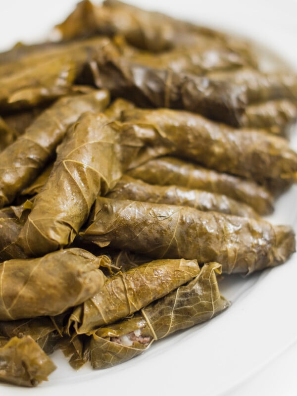 Always a crowd pleaser, these meat- stuffed grape leaves are delicious warm, cold or room temperature. My mom loves to add celery stalks and a couple of cabbage leaves to the pot for added avor while cooking.