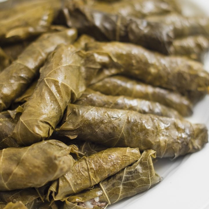 Always a crowd pleaser, these meat- stuffed grape leaves are delicious warm, cold or room temperature. My mom loves to add celery stalks and a couple of cabbage leaves to the pot for added avor while cooking.