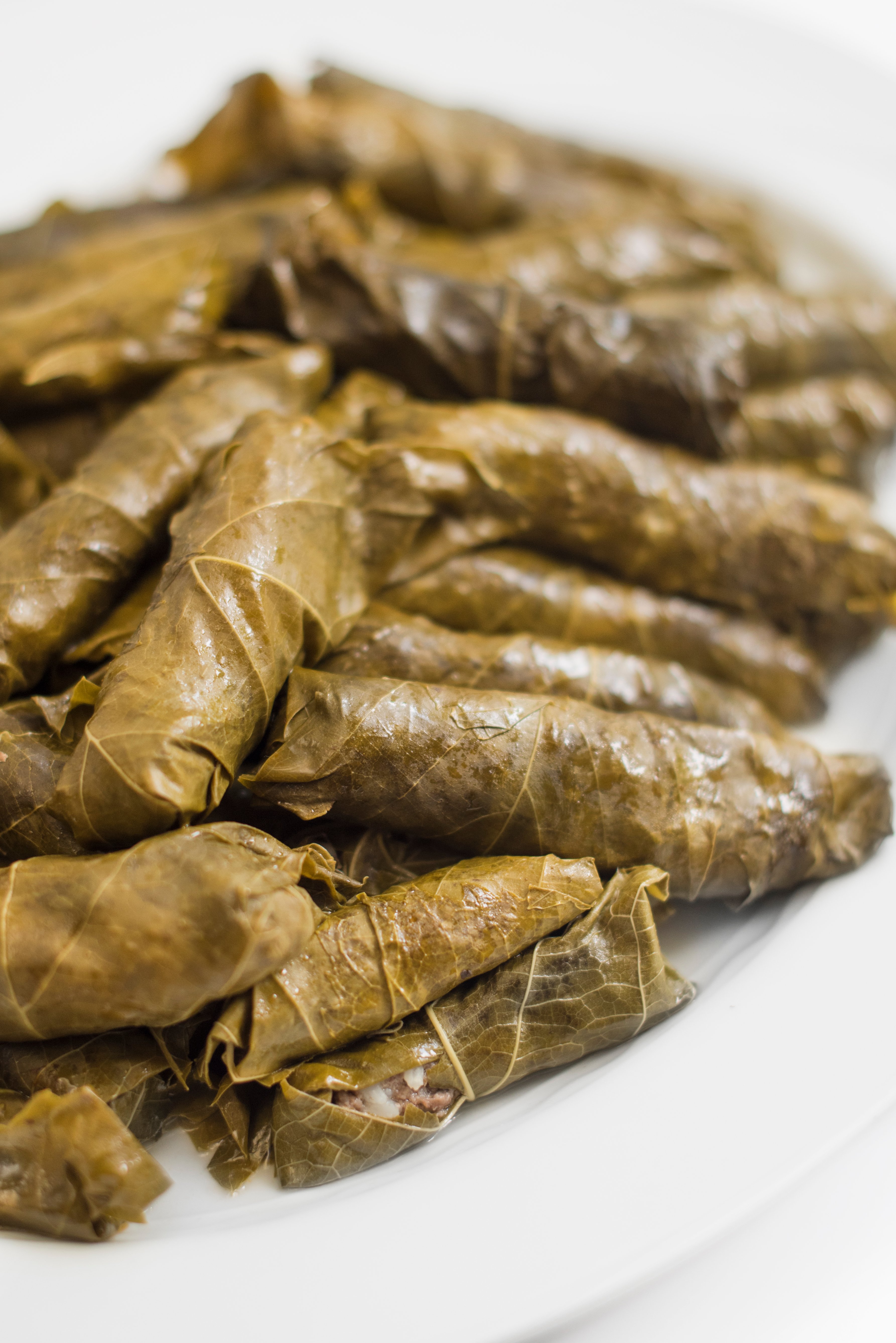 Always a crowd pleaser, these meat- stuffed grape leaves are delicious warm, cold or room temperature. My mom loves to add celery stalks and a couple of cabbage leaves to the pot for added avor while cooking.