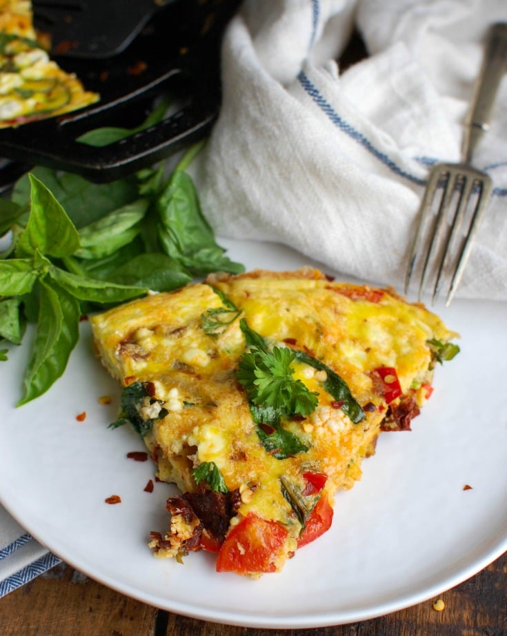 Sun-Dried Tomato Goat Cheese Frittata is a savory breakfast packed with healthy, filling ingredients. Sun-Dried tomatoes, spinach, red bell pepper, goat cheese and eggs are cooked and then baked to perfection. Serve this at a brunch or make it ahead of time for a quick weekday breakfast.