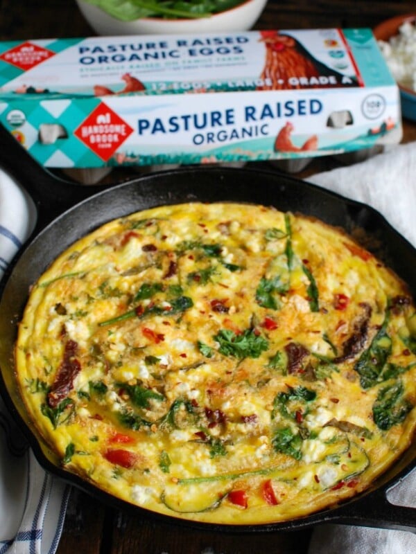 Sun-Dried Tomato Goat Cheese Frittata is a savory breakfast packed with healthy, filling ingredients. Sun-Dried tomatoes, spinach, red bell pepper, goat cheese and eggs are cooked and then baked to perfection. Serve this at a brunch or make it ahead of time for a quick weekday breakfast.