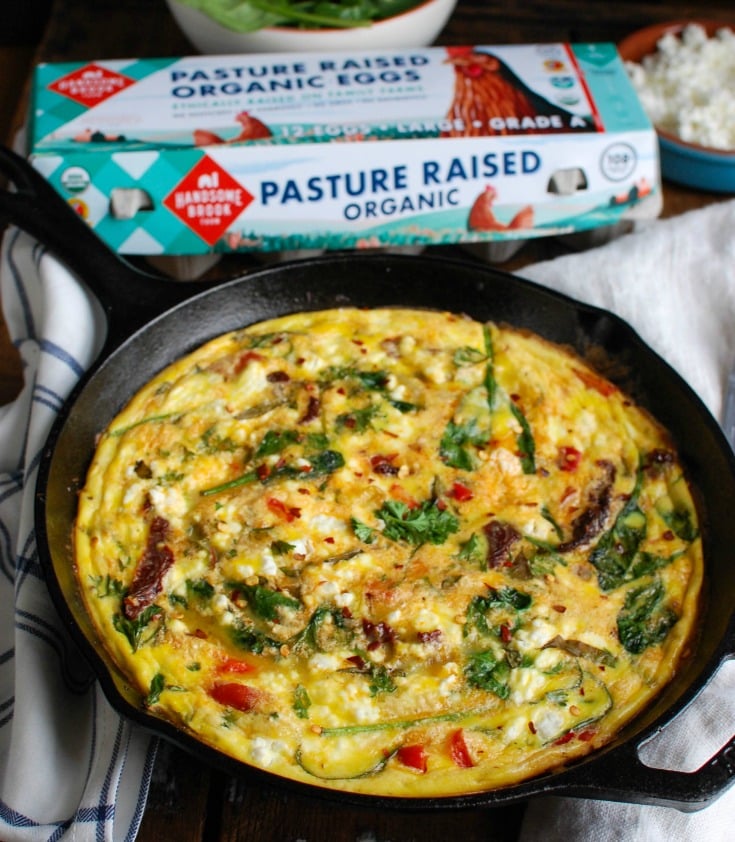 Sun-Dried Tomato Goat Cheese Frittata is a savory breakfast packed with healthy, filling ingredients. Sun-Dried tomatoes, spinach, red bell pepper, goat cheese and eggs are cooked and then baked to perfection. Serve this at a brunch or make it ahead of time for a quick weekday breakfast.