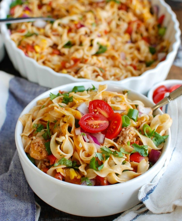 Easy Mexican Noodle Casserole makes weeknight meals easy, fun and festive with a colorful casserole packed with No Yolk Noodles,  colorful vegetables, ground turkey, spices and cheese. This dish will quickly become a family favorite. 