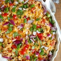 Easy Mexican Noodle Casserole makes weeknight meals easy, fun and festive with a colorful casserole packed with No Yolk Noodles,  colorful vegetables, ground turkey, spices and cheese. This dish will quickly become a family favorite. 