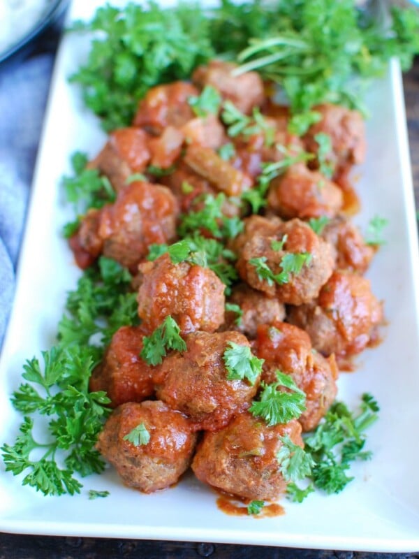 Slow Cooker Mediterranean Beef Meatballs with Lebanese Green Beans is full of warm spices and slow cooks in your crockpot to make dinner easy. Beef meatballs are spiced with Mediterranean flavors and slow cooker in Lebanese green beans creating the perfect sauce paired with the meatballs and rice.  