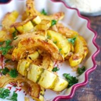 Roasted Parmesan Delicata Squash is sweet, savory and the perfect fall side dish. Delicata squash is roasted until soft and topped with parmesan cheese for the perfect flavor combination. This would also make a wonderful holiday side dish! 