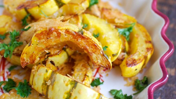 Roasted Parmesan Delicata Squash is sweet, savory and the perfect fall side dish. Delicata squash is roasted until soft and topped with parmesan cheese for the perfect flavor combination. This would also make a wonderful holiday side dish!