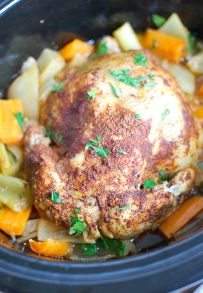 Slow Cooker Mediterranean Whole Chicken is tender, juicy and rich with Mediterranean flavors. Cooking a whole chicken in the slow cooker is not only easy but is a great way to meal plan since it can provide you with enough chicken for multiples meals during the week.