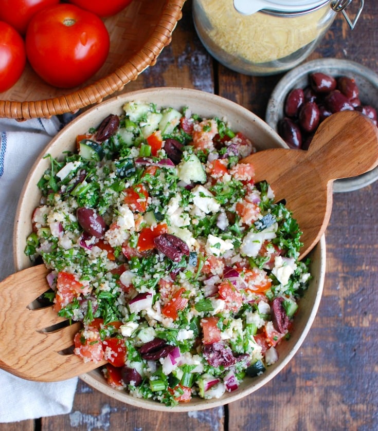 Greek Tabbouleh with serving spoons.