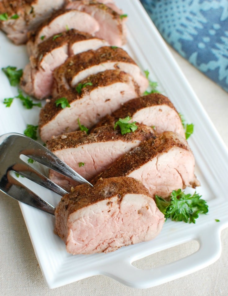 Mediterranean Baked Pork Tenderloin is tender, juicy and full of flavors from the Mediterranean. Pork tenderloin is rubbed with a warm Mediterranean spice mixture and baked to perfection. This is an easy weeknight meal the whole family will love! 