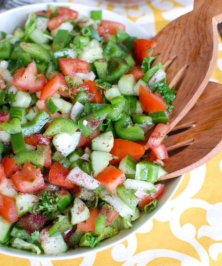 Easy Lebanese Salad, also known as Lebanese Salata, is a salad mixing chopped tomatoes, bell pepper, onion, cucumber, green onion and parsley topped with a lemony-mint dressing. This is healthy, light and the prefect addition to any meal or add grilled chicken or salmon to make it a meal itself. 
