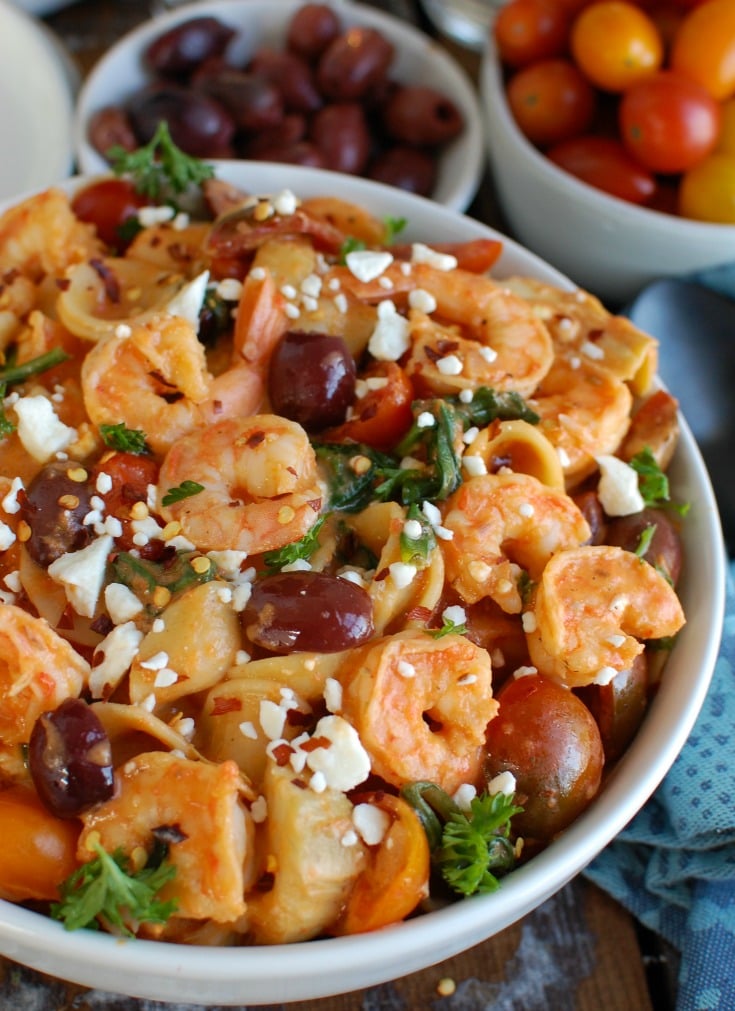 Â One Pot Mediterranean Shrimp Pasta is an easy one pot meal mixing shrimp with your favorite Mediterranean ingredients, pasta and a creamy roasted red pepper sauce. Shrimp pairs nicely with the fresh tomatoes, artichokes, kalamata olives, spinach and is topped with a creamy roasted red pepper sauce. Â 