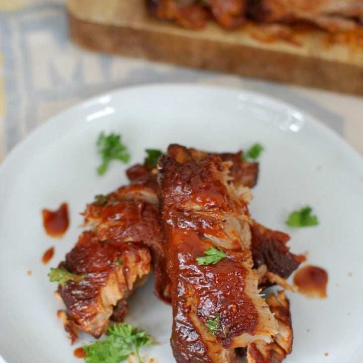 Slow Cooker Barbecue Ribs are fall off the bone tender and full of warm spices and flavor. These ribs cook in a slow cooker saving you time and making this meal easy and perfect for a crowd! 